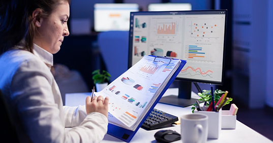 Woman looking at charts on a piece of paper